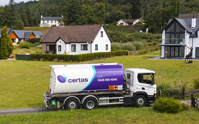 Certas Energy truck driving to house in the country.